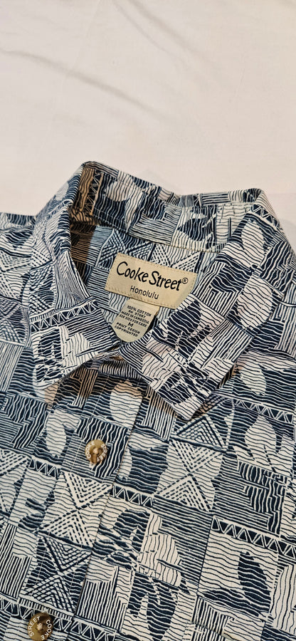 Patterned shirt with a brand label on a light background