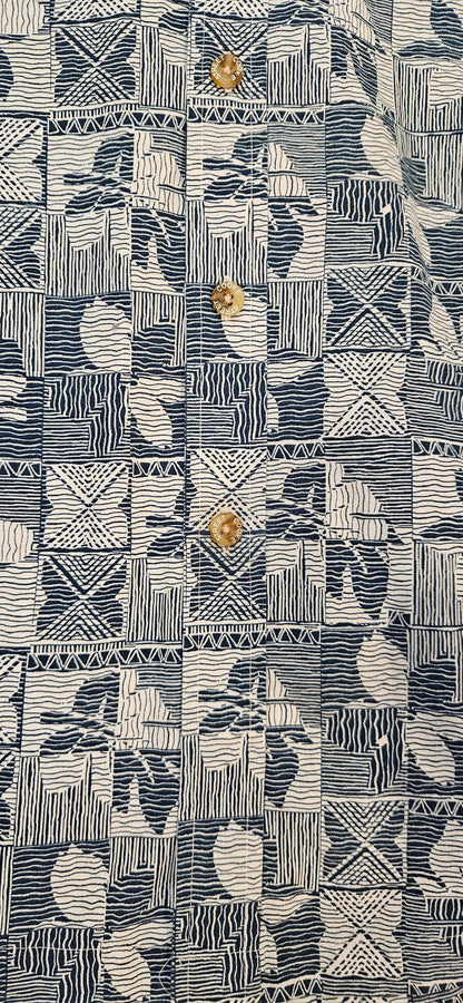 Textured patterned fabric with geometric shapes and abstract designs.