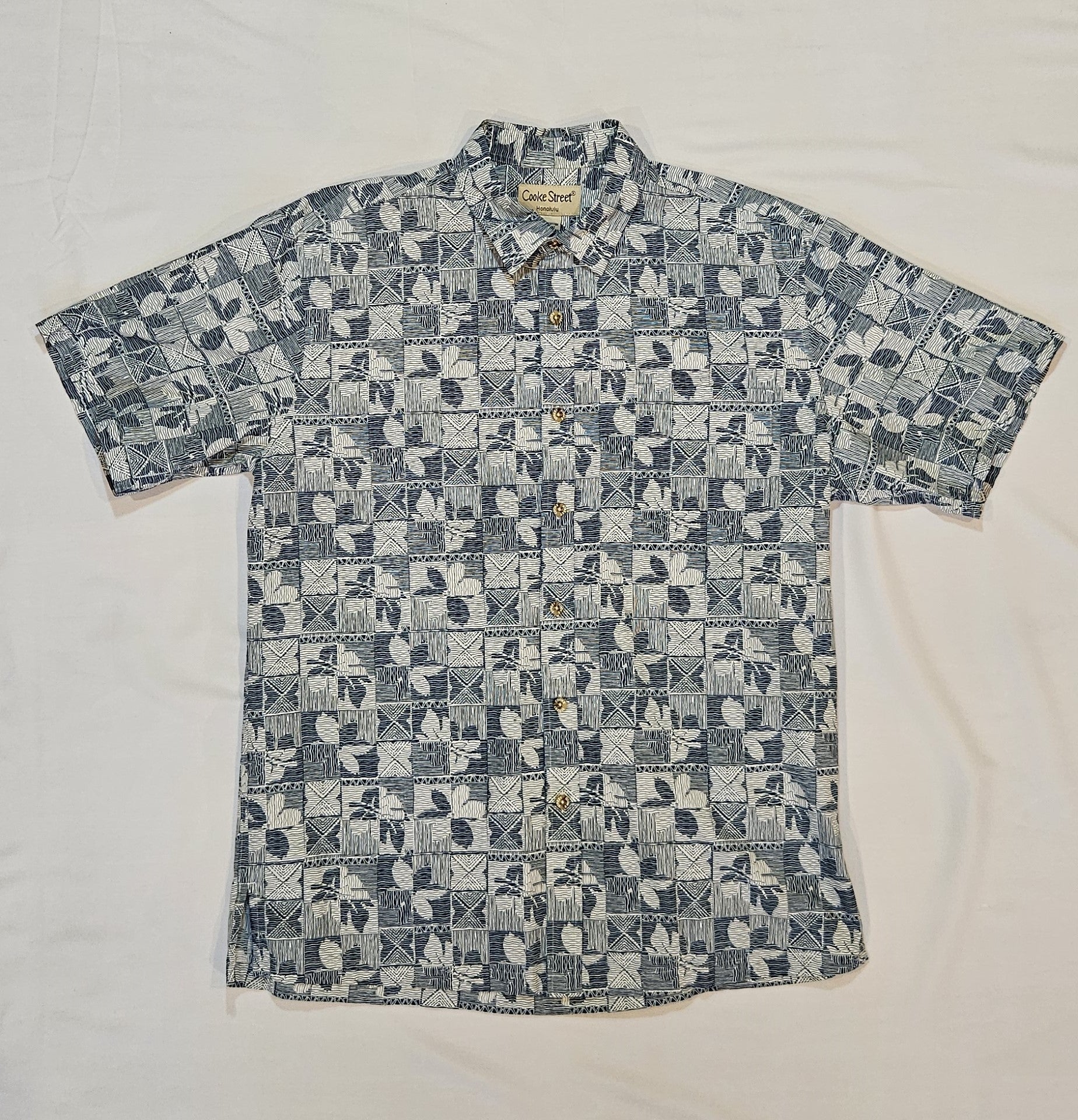 Short-sleeve shirt with a geometric pattern on a white background